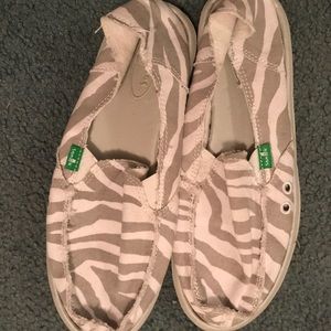 Gray and white Sanuk slip on shoes